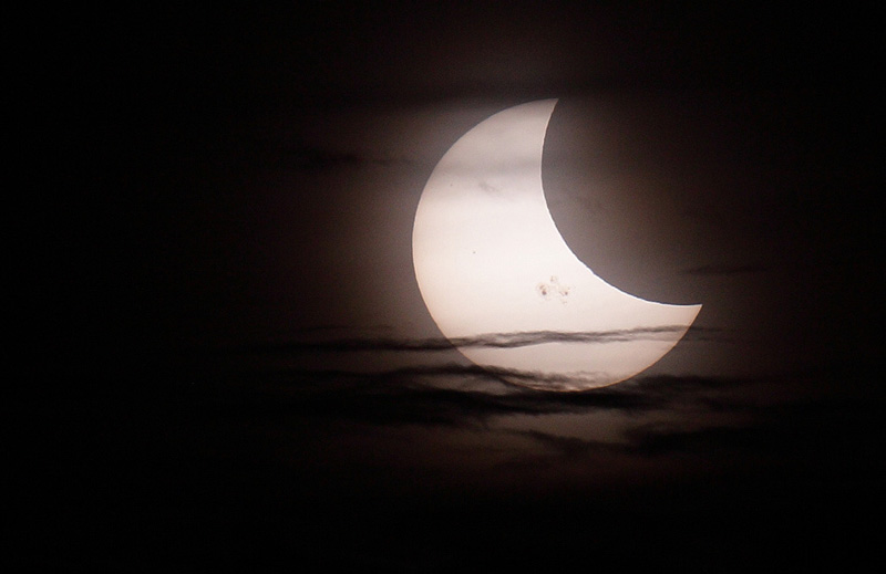 Closeup of eclipse with clouds